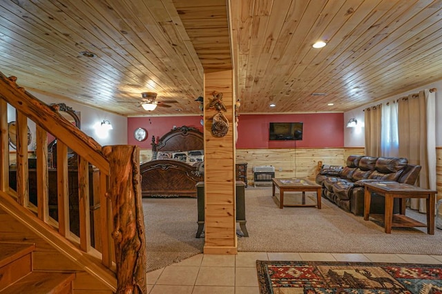 living area with light carpet, a wainscoted wall, wood ceiling, light tile patterned flooring, and recessed lighting