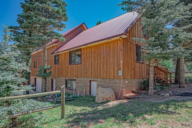 view of home's exterior with metal roof