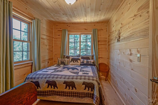 bedroom with wood ceiling and wooden walls