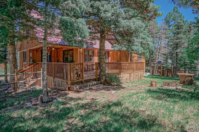 view of yard with a fire pit and a deck