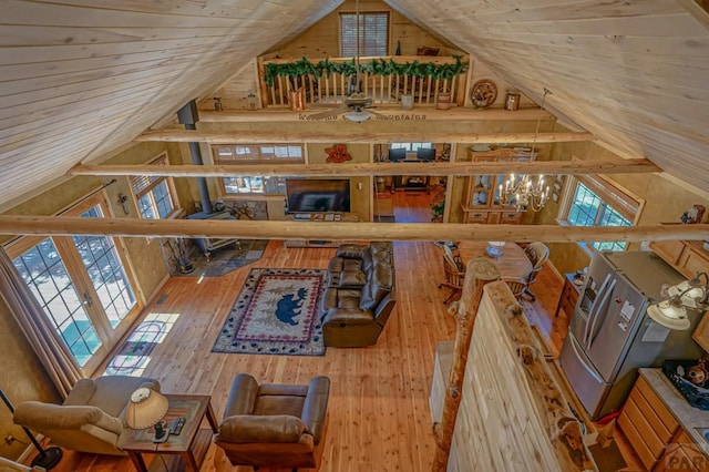 interior space featuring high vaulted ceiling, wood finished floors, and wood ceiling