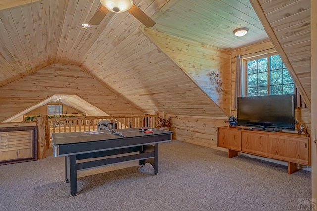 rec room featuring carpet floors, wooden ceiling, vaulted ceiling, and wooden walls