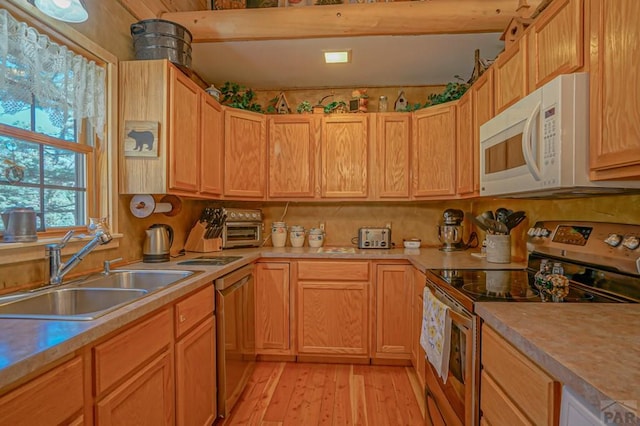 kitchen with light countertops, stainless steel electric range oven, and white microwave