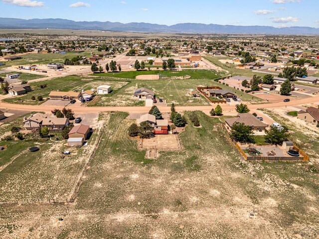 950 S Los Charros Dr, Pueblo West, CO 81007 - aerial view of residential area featuring a mountainous background