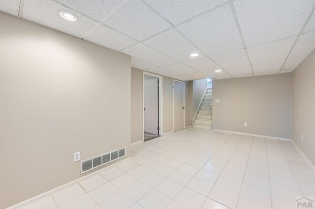 950 S Los Charros Dr, Pueblo West, CO 81007 - unfurnished room with stairway, recessed lighting, a drop ceiling, and light tile patterned flooring
