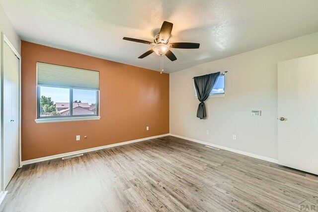 950 S Los Charros Dr, Pueblo West, CO 81007 - spare room featuring light wood-style flooring and a ceiling fan