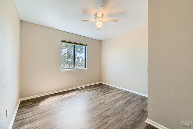 950 S Los Charros Dr, Pueblo West, CO 81007 - spare room featuring wood finished floors and a ceiling fan