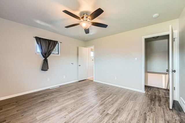 950 S Los Charros Dr, Pueblo West, CO 81007 - unfurnished bedroom featuring wood finished floors and a ceiling fan