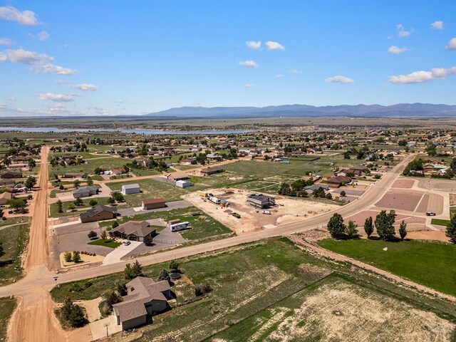 950 S Los Charros Dr, Pueblo West, CO 81007 - aerial perspective of suburban area featuring a water and mountain view