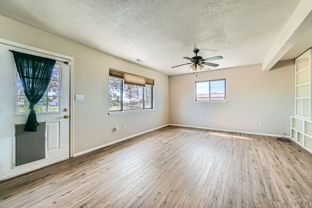 950 S Los Charros Dr, Pueblo West, CO 81007 - unfurnished room featuring a textured ceiling, wood finished floors, and a ceiling fan