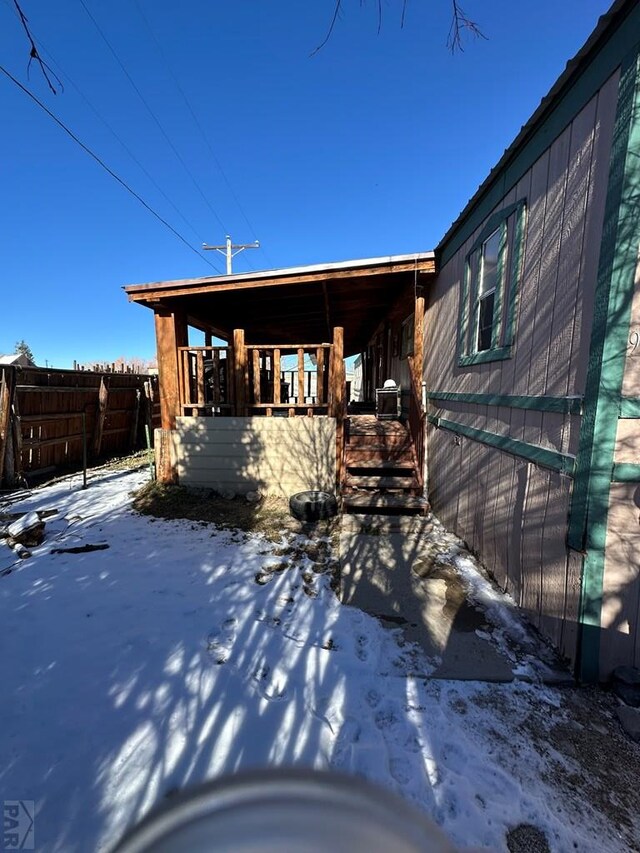 view of front of house featuring fence