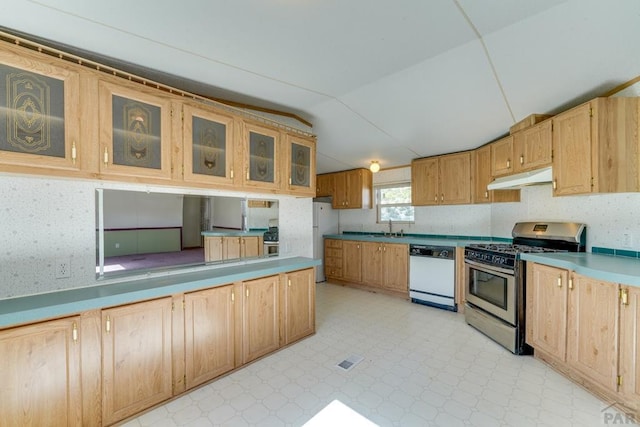 kitchen with white appliances, glass insert cabinets, light floors, light countertops, and under cabinet range hood