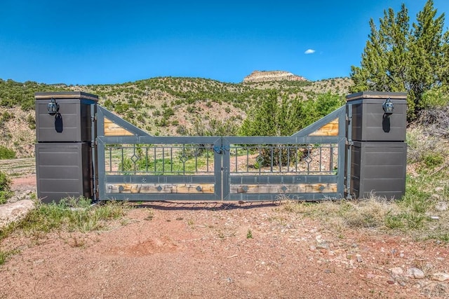 view of gate featuring a mountain view