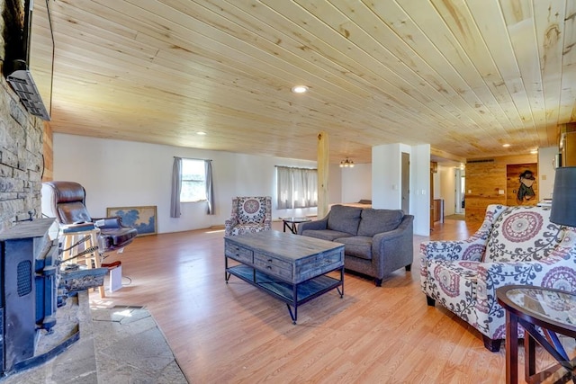 living area with light wood-style floors and wood ceiling