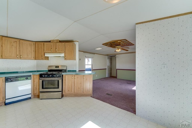 kitchen with stainless steel gas stove, open floor plan, white dishwasher, light countertops, and under cabinet range hood