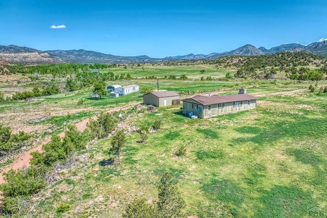 aerial view with a mountain view and a rural view