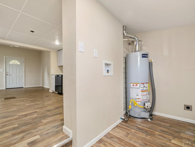 1415 E 2nd St, Pueblo, CO 81001 - utility room featuring water heater