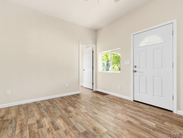 1415 E 2nd St, Pueblo, CO 81001 - foyer entrance with baseboards, light wood-style floors, and ceiling fan