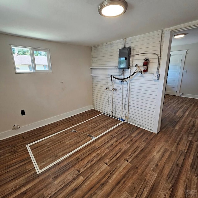 1938 E 6th St, Pueblo, CO 81001 - unfurnished room featuring wood walls, wood finished floors, and electric panel