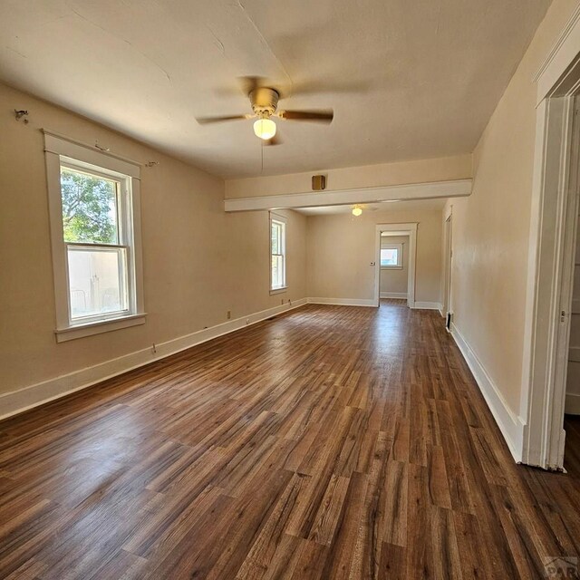 1938 E 6th St, Pueblo, CO 81001 - spare room with dark wood-style flooring and a ceiling fan