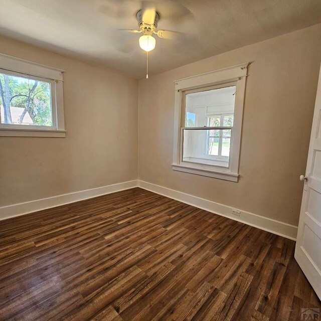1938 E 6th St, Pueblo, CO 81001 - spare room with dark wood finished floors and a ceiling fan