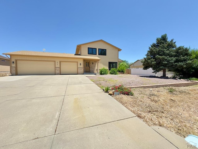 476 S Hahns Peak Ave, Pueblo West, CO 81007 - view of front of property with a garage and driveway