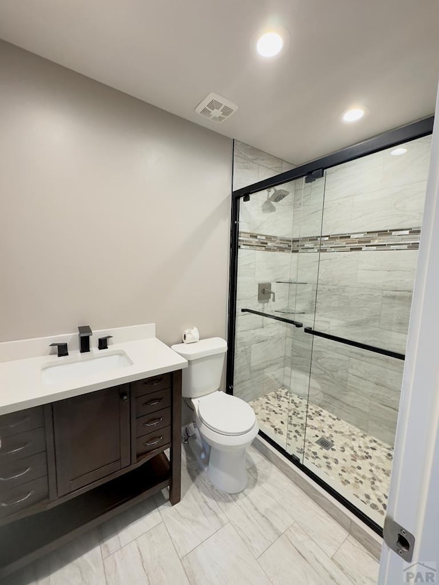 476 S Hahns Peak Ave, Pueblo West, CO 81007 - full bathroom featuring recessed lighting, a shower stall, and vanity