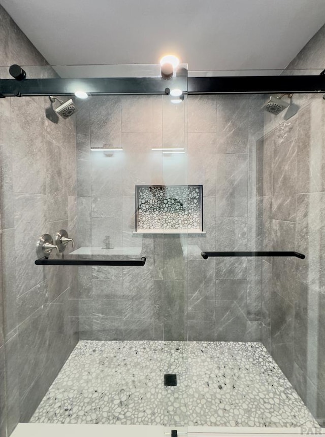 476 S Hahns Peak Ave, Pueblo West, CO 81007 - bathroom featuring a shower stall