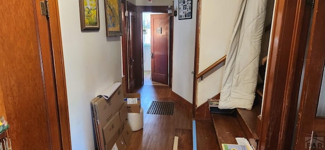 corridor with dark wood-type flooring