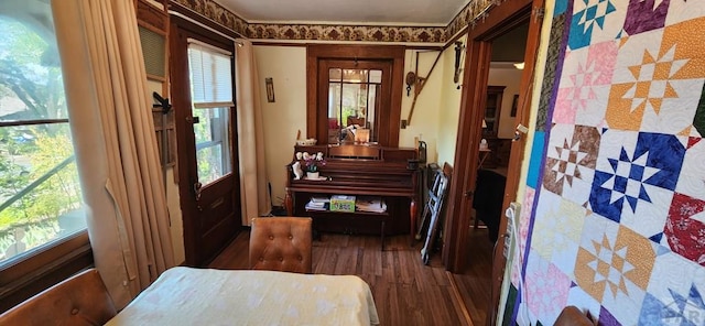 living area with a healthy amount of sunlight and wood finished floors