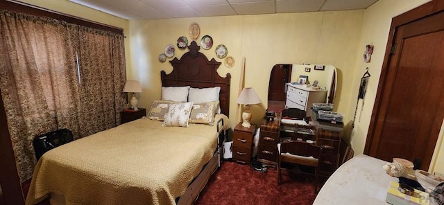 bedroom featuring arched walkways and dark colored carpet