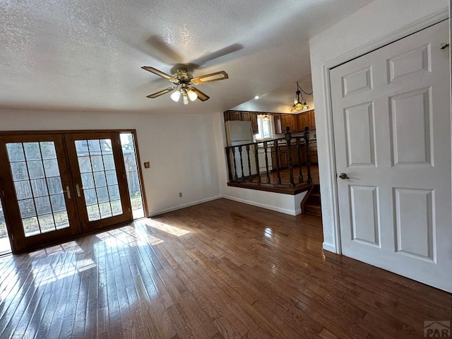 interior space featuring dark wood-style floors, plenty of natural light, and french doors