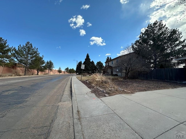 view of street with sidewalks and street lighting