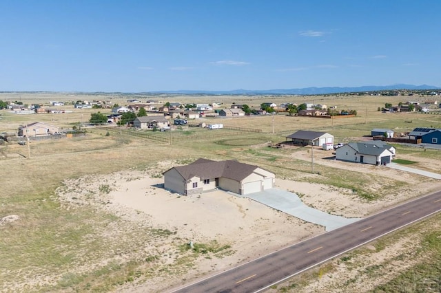 aerial view featuring a rural view and a mountain view