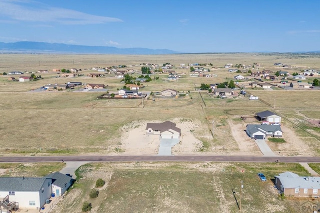 birds eye view of property featuring a rural view and a mountain view