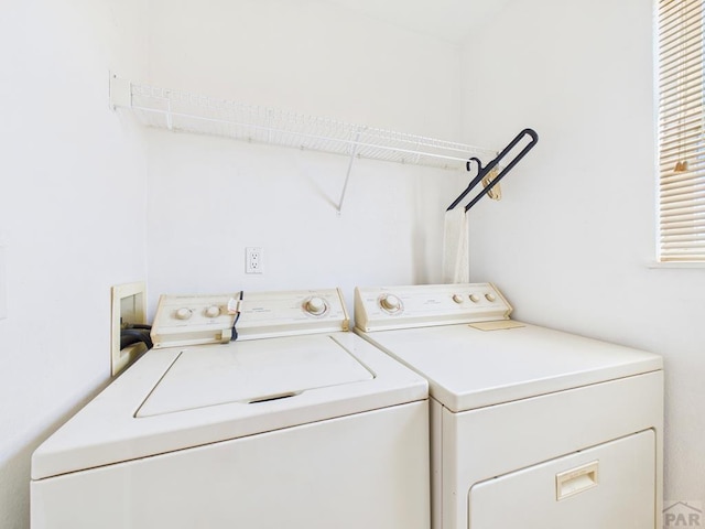 washroom with washer and dryer and laundry area