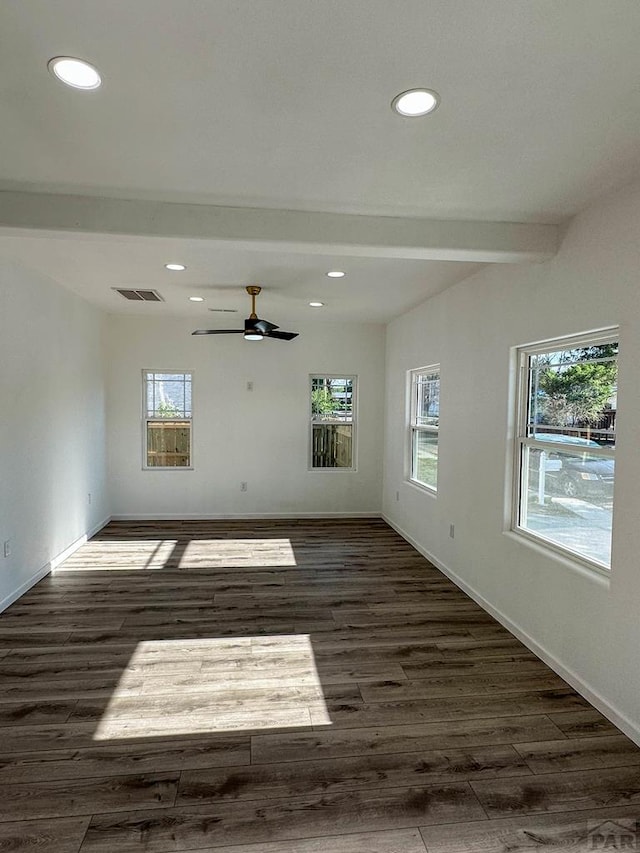 unfurnished room featuring recessed lighting, visible vents, baseboards, beam ceiling, and dark wood finished floors