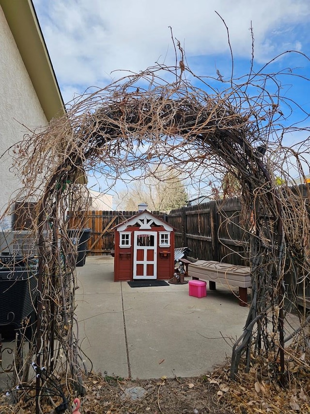 view of shed featuring a fenced backyard