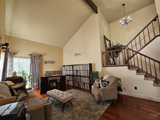 living room with stairway, wood finished floors, baseboards, and high vaulted ceiling