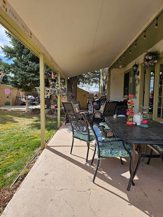 view of patio / terrace featuring outdoor dining area and fence