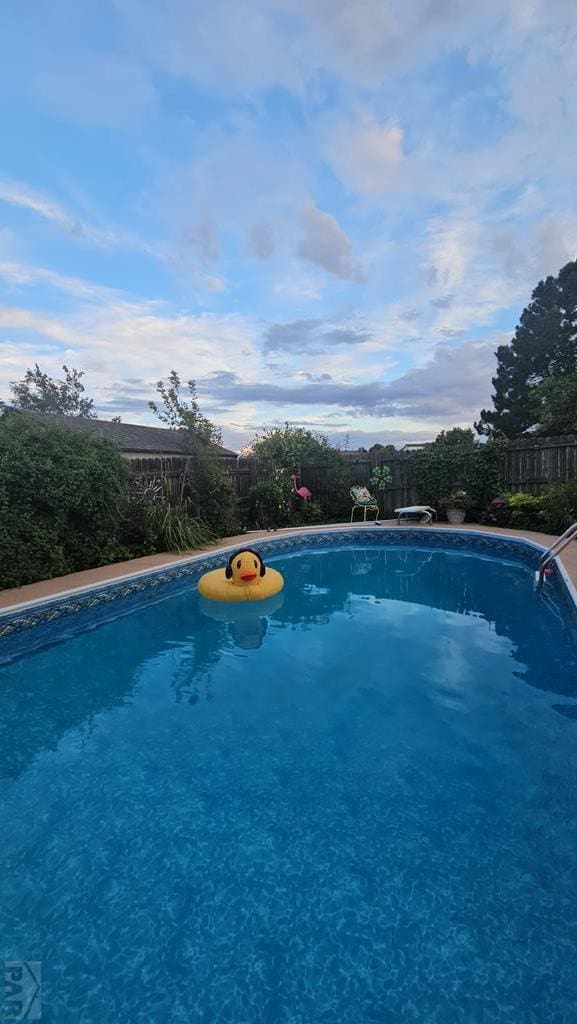 pool with a fenced backyard