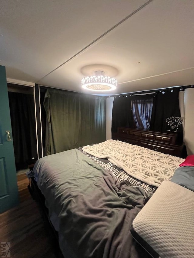 bedroom featuring dark wood-style floors