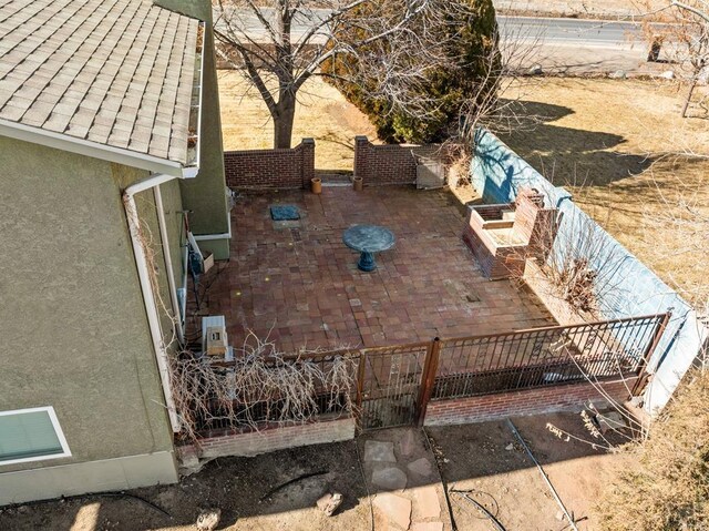 view of patio / terrace featuring fence