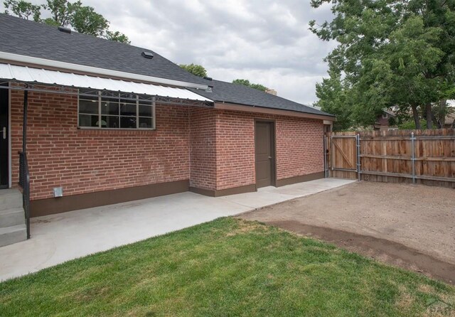 exterior space featuring fence and a gate