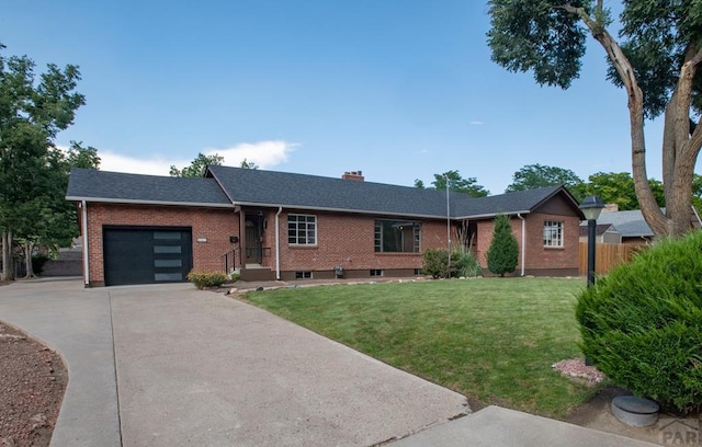 ranch-style home with a front yard, brick siding, driveway, and an attached garage