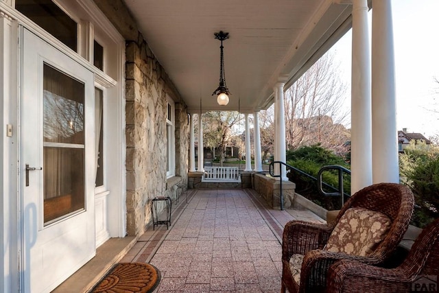 view of patio featuring a porch