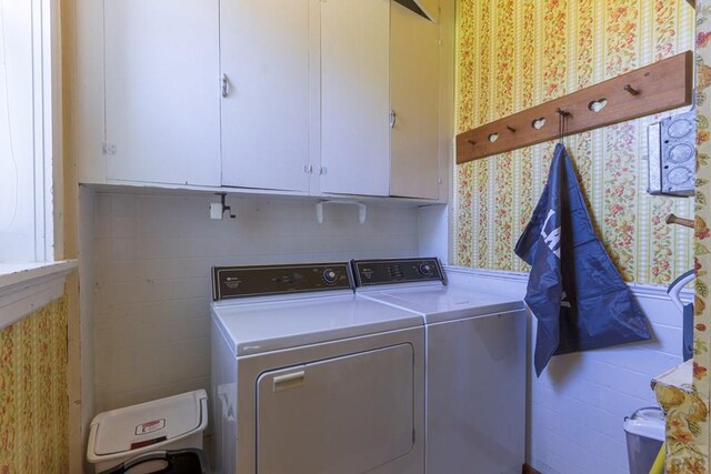 laundry area with cabinet space and washer and dryer