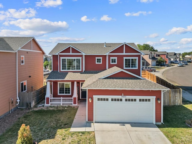 view of front facade with an attached garage, fence, concrete driveway, roof with shingles, and a residential view