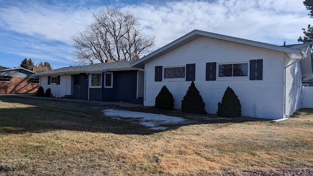 232 Saddle Rd, Trinidad, CO 81082 - view of front of home with a front yard, a chimney, and brick siding