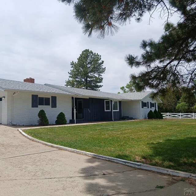 232 Saddle Rd, Trinidad, CO 81082 - ranch-style house featuring brick siding, board and batten siding, and a chimney
